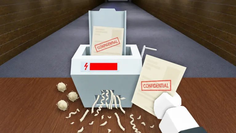 Shred the Secrets shredder with confidential papers